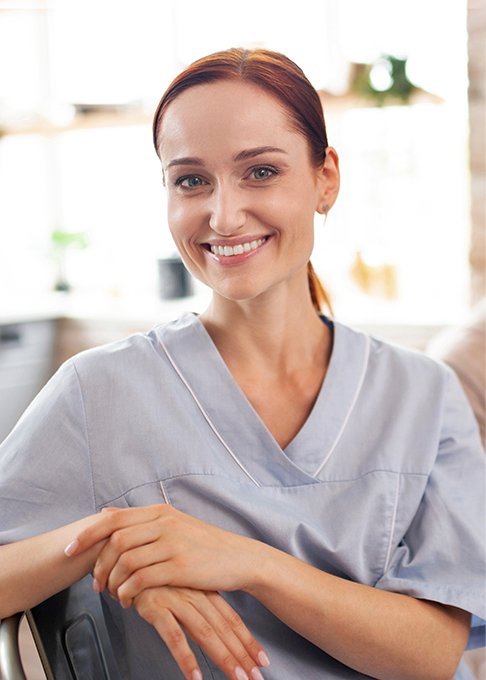 Healthcare professional smiling at camera